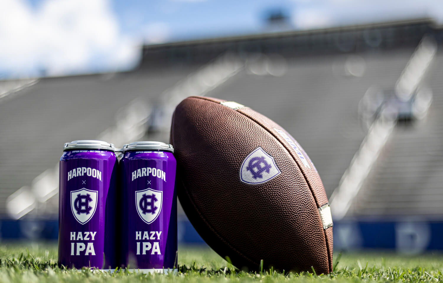 Photo of Harpoon x Holy Cross Hazy IPA beer cans on campus
