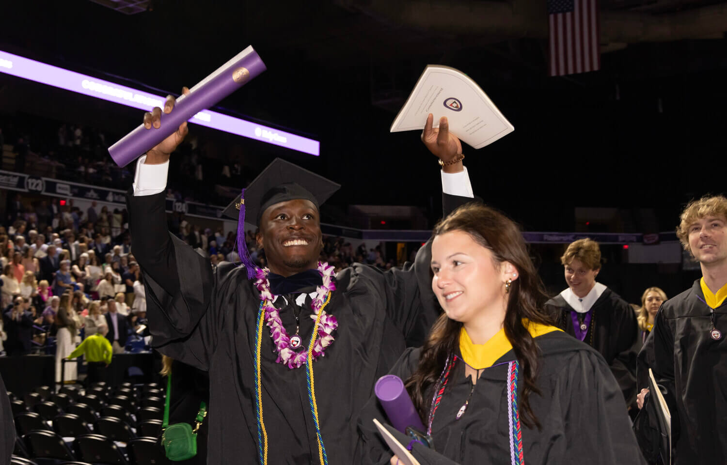 Students in procession celebrating their college graduation
