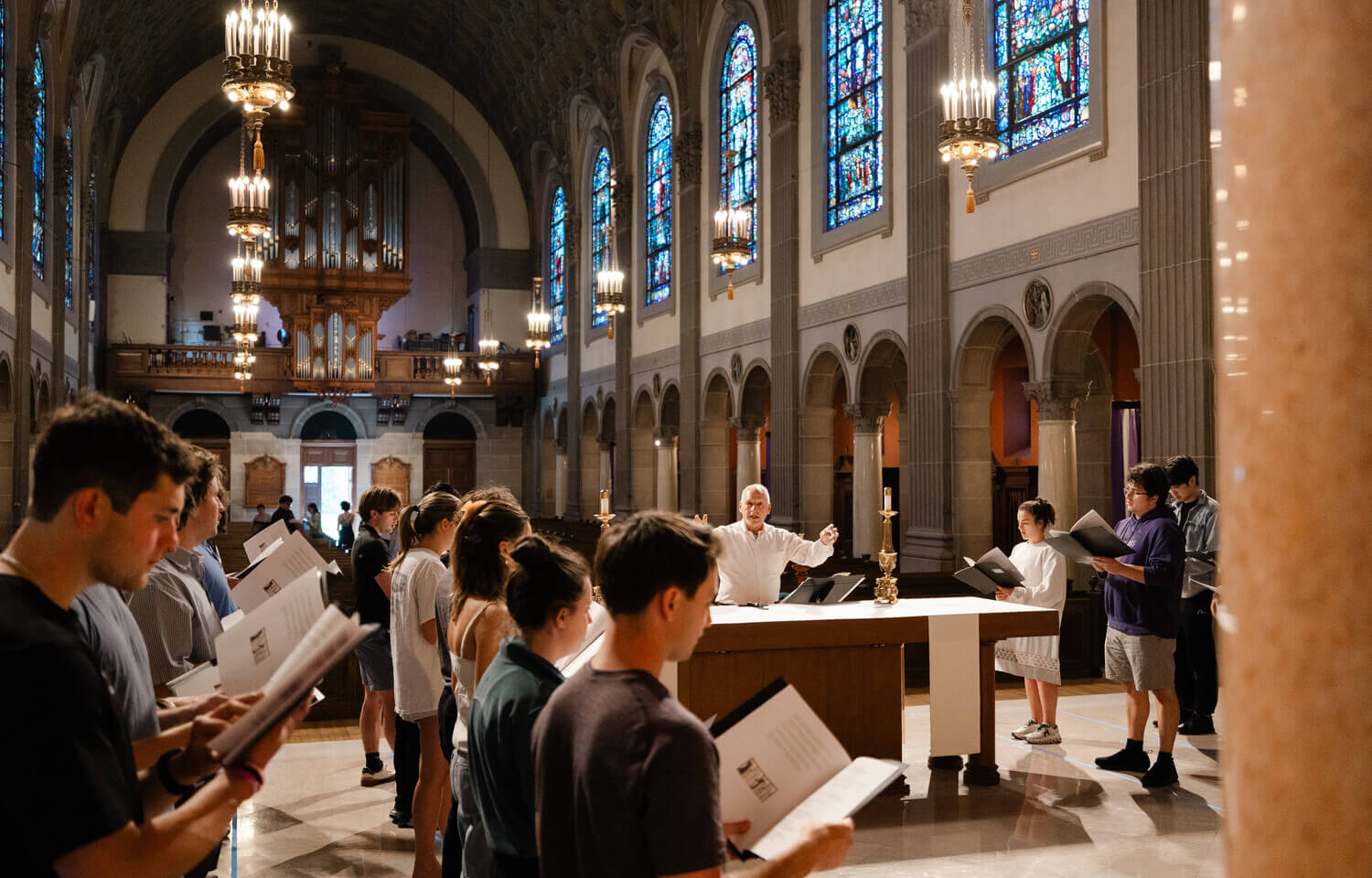 Students singing Gregorian chant in St. Joseph Chapel