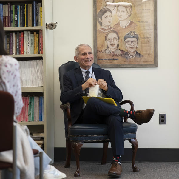 Dr. Anthony Fauci sitting in a chair