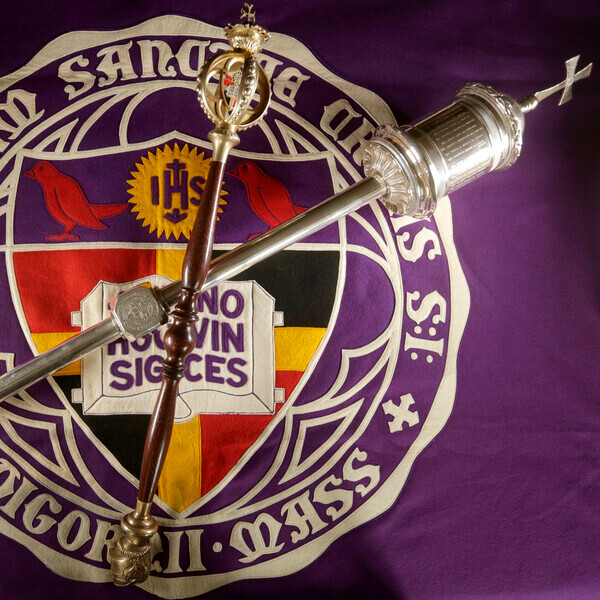Holy Cross' maces arranged on a banner of the former seal of the College