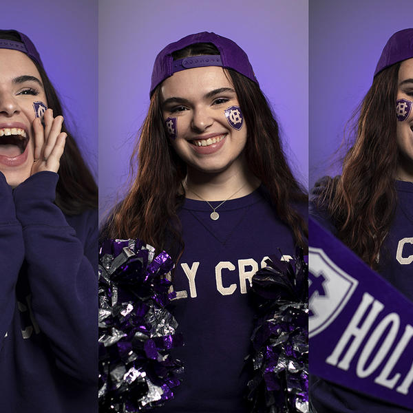 Holy Cross student wears purple school colors and cheers