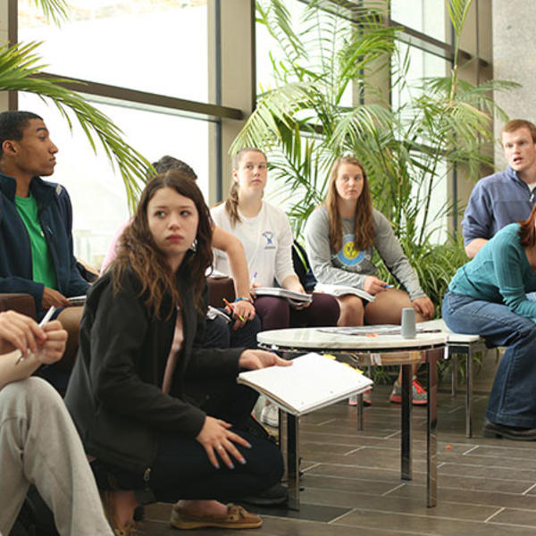 Ann Sheehy, professor of biology, is seen here leading her Montserrat class in oral presentations. Photo by Tom Rettig