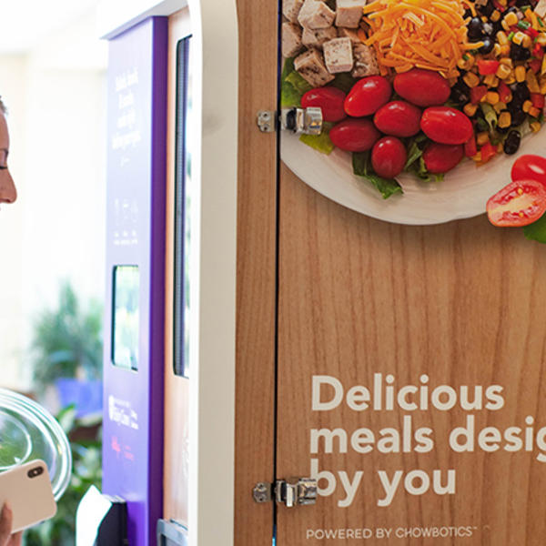 Image of student using Sally the Food Robot. Photo courtesy of Holy Cross Dining