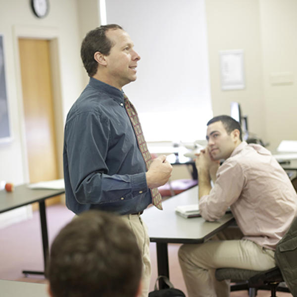 Victor Matheson, professor of economics, is seen here teaching a class at Holy Cross. Photo by Tom Rettig