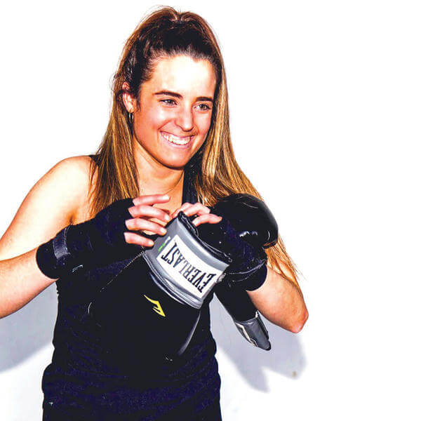Mary Kate Vanecko ’17 posts with boxing gloves in her senior year at Holy Cross