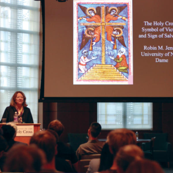 Robin Jensen speaks during a lecture on the meaning behind the imagery of the cross
