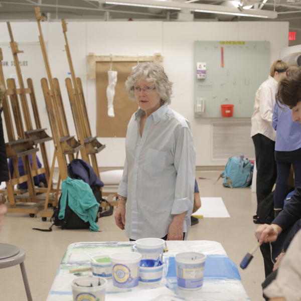 Students work on a mosaic tile project with professor Virginia Raguin.