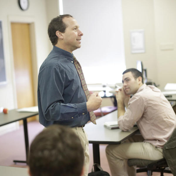 Victor Matheson, professor of economics, is seen here teaching a class at Holy Cross in 2018. Photo by Tom Rettig