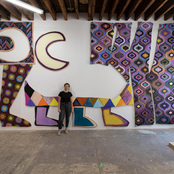 Justine Hill '08 in front of “The Travelers” (2022) in her studio in Brooklyn, NY. Courtesy Denny Dimin Gallery, New York.