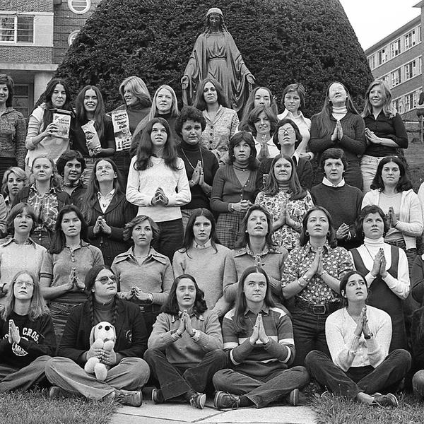 A large group of women pose for a photo