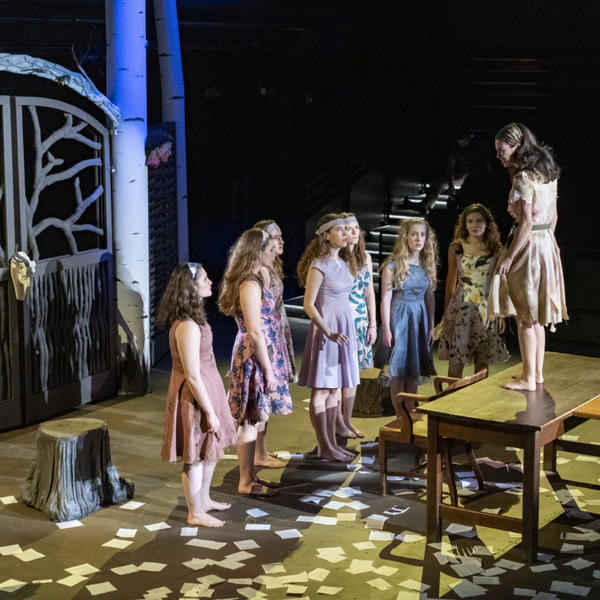 College students on stage during play rehearsal.