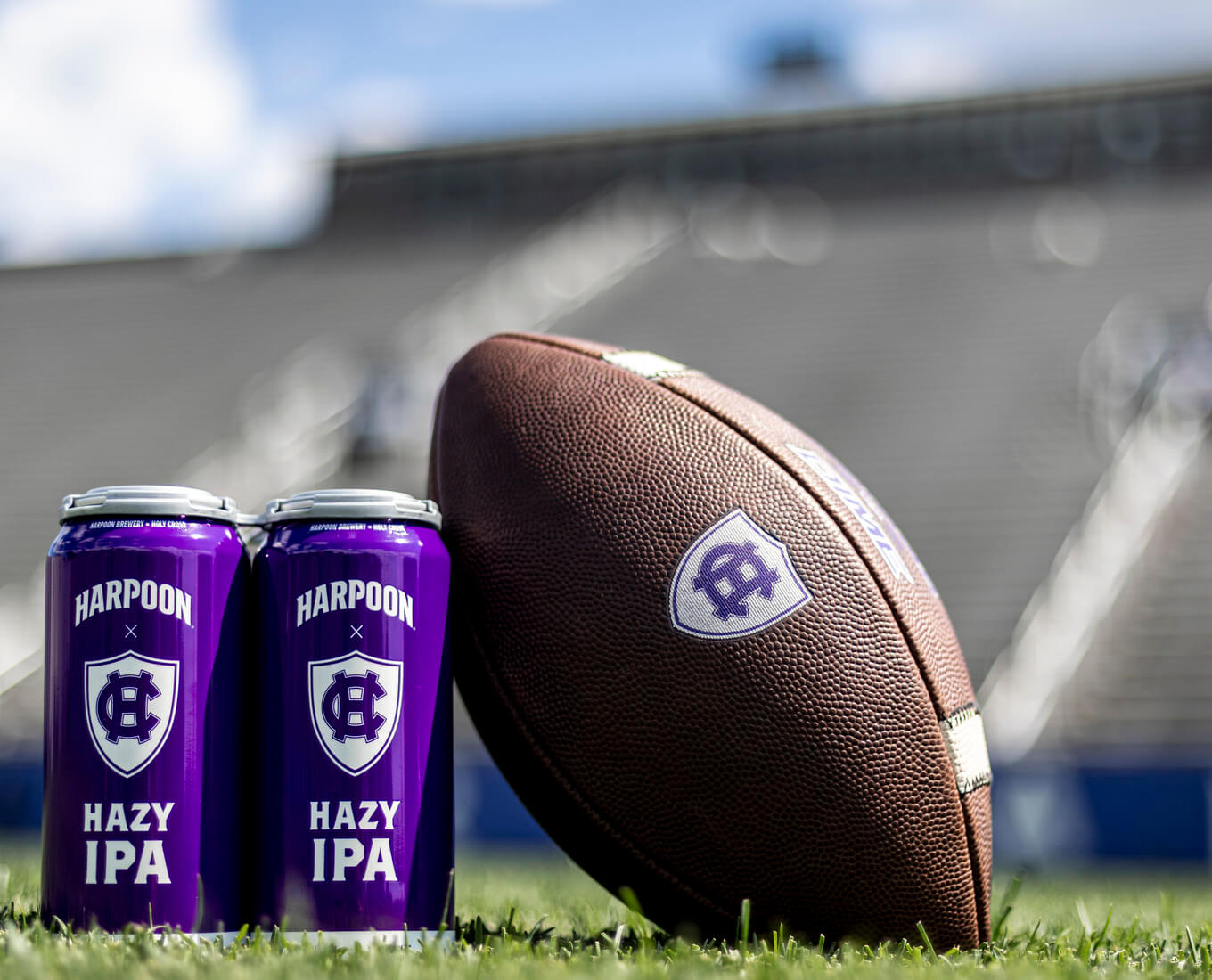 Photo of Harpoon x Holy Cross Hazy IPA beer cans on campus