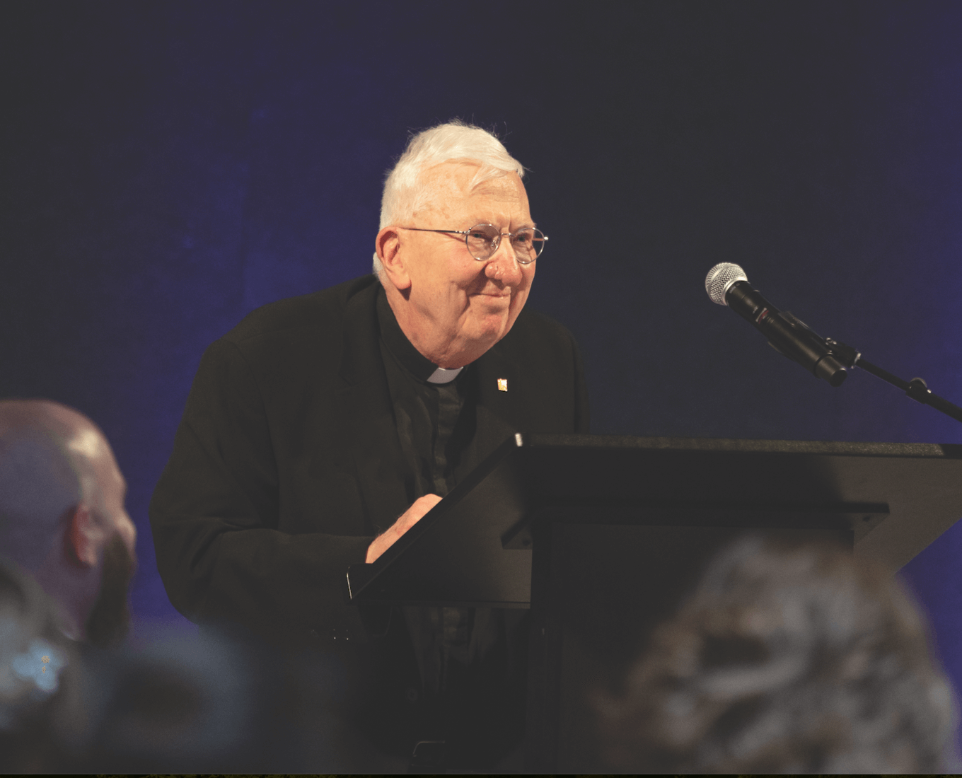 priest at podium