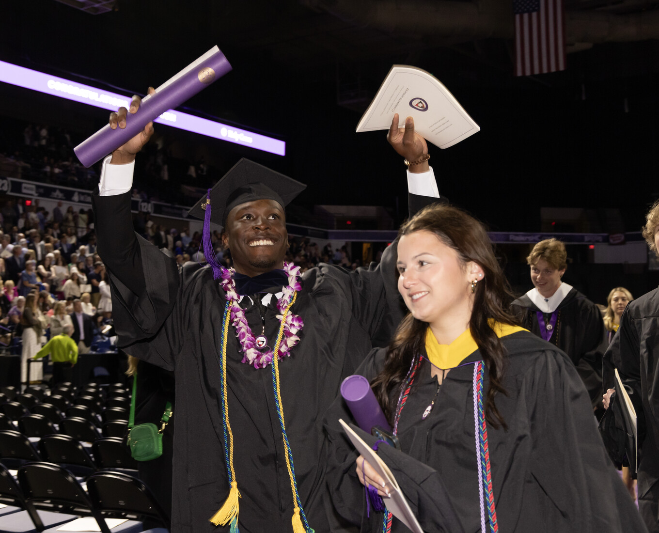 Students in procession celebrating their college graduation