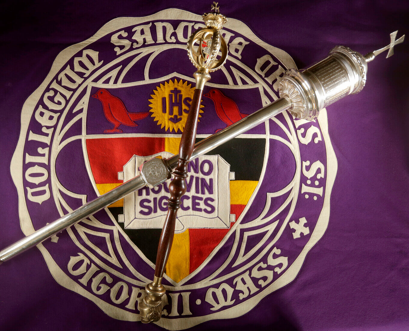 Holy Cross' maces arranged on a banner of the former seal of the College