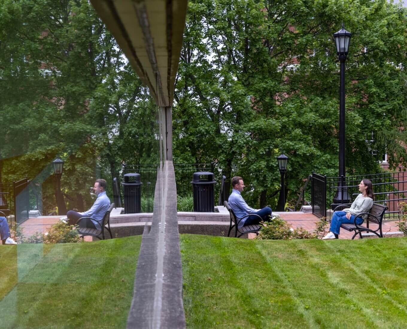 Two people sit across from each other in chairs