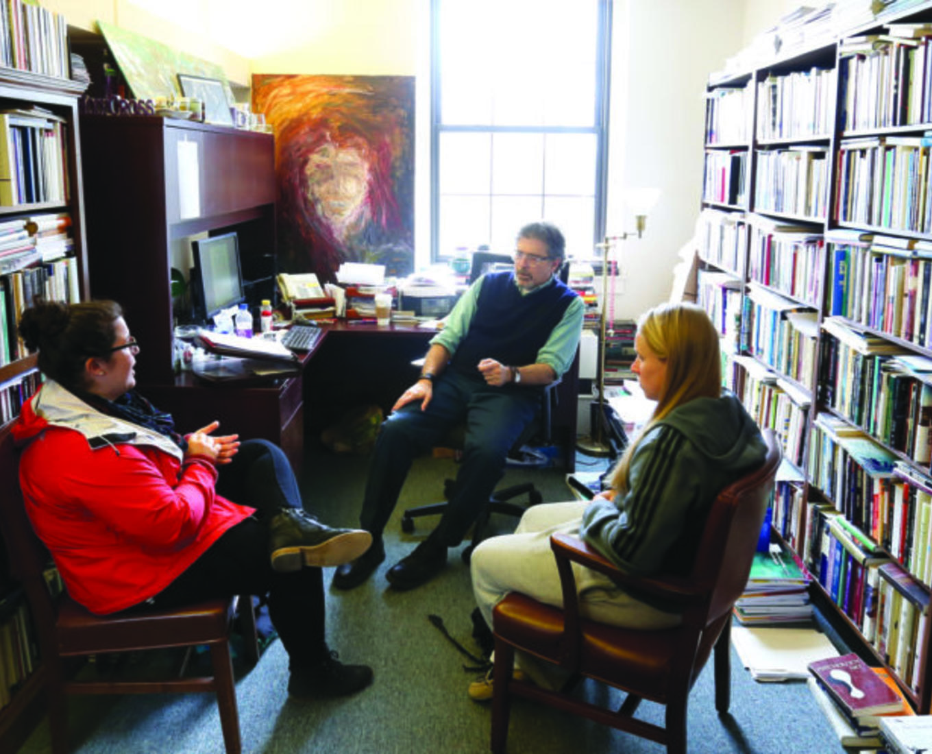 Student office hours with Mark Freeman, Holy Cross Distinguished Professor of Ethics and Society and professor of psychology. Photo by Tom Rettig