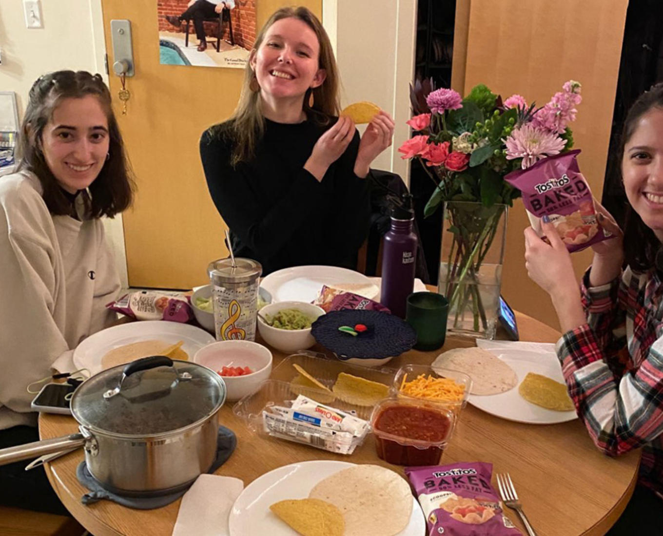 students showing off their meal kit. Photo by Meghan O'Keefe '21