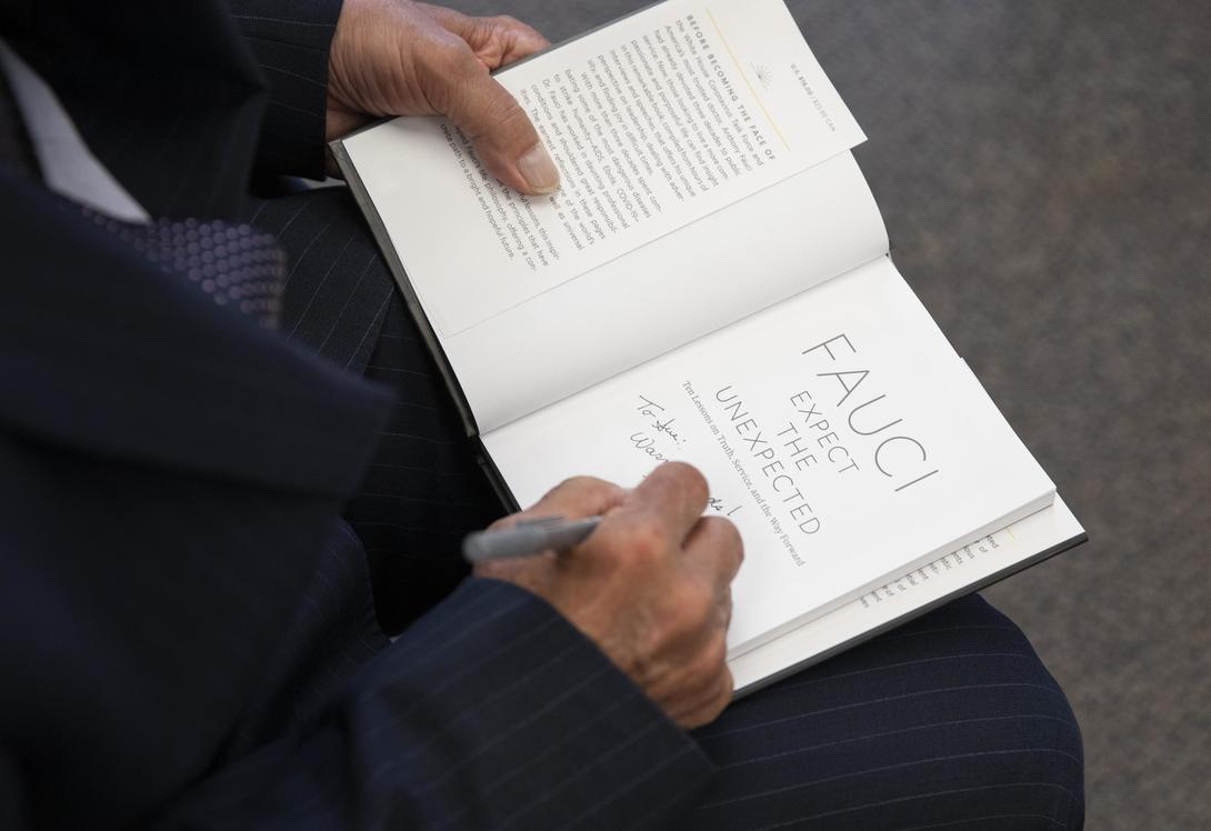 A man signing a book