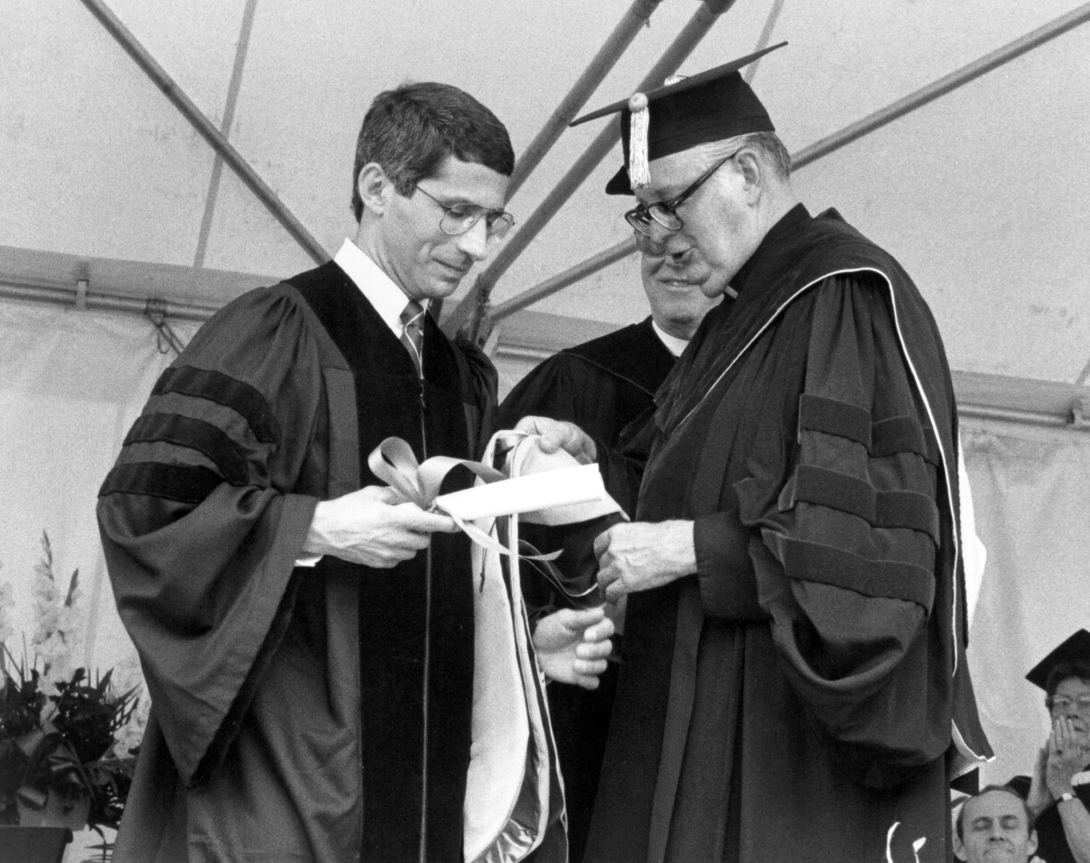 Fauci receives an honorary degree in 1987 from Holy Cross President Rev. John Brooks, S.J., ’49.